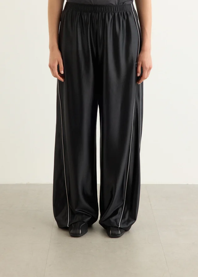 Alexander Wang Mid-Rise Trackpants With Reflective Piping in BLACK, image 1 of 1 from Incu