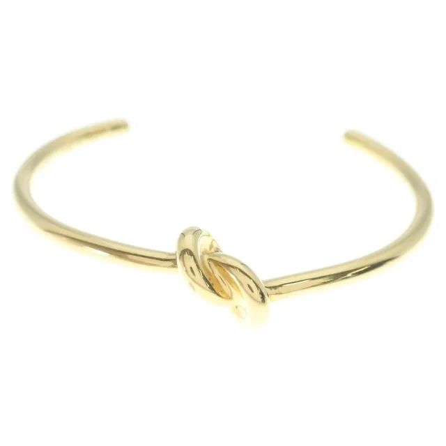 Celine Knot Extra Thin Bracelet Bangle Plated Gold in Gold from The Reluxe, photo 1 of 1
